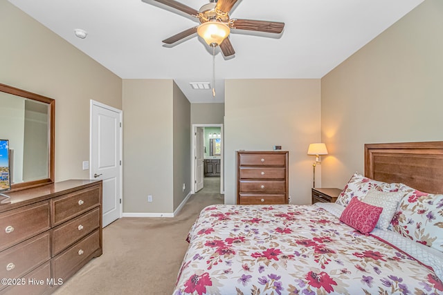 bedroom with ceiling fan and light carpet