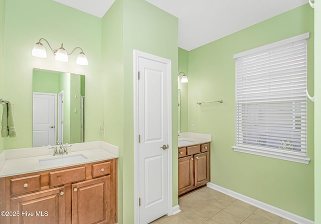 bathroom with vanity and tile patterned floors