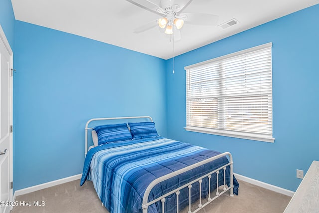 bedroom with ceiling fan and carpet flooring