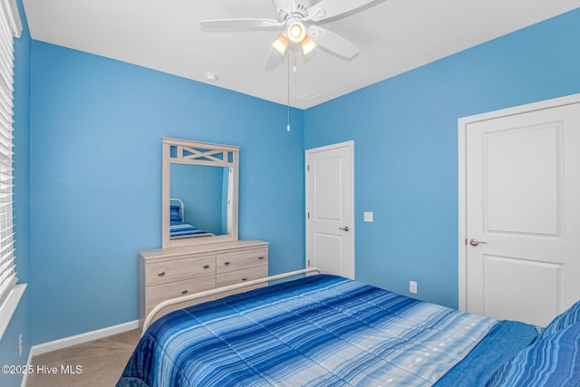 carpeted bedroom featuring ceiling fan