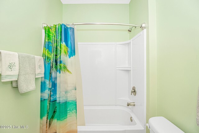 bathroom featuring toilet and shower / bath combo