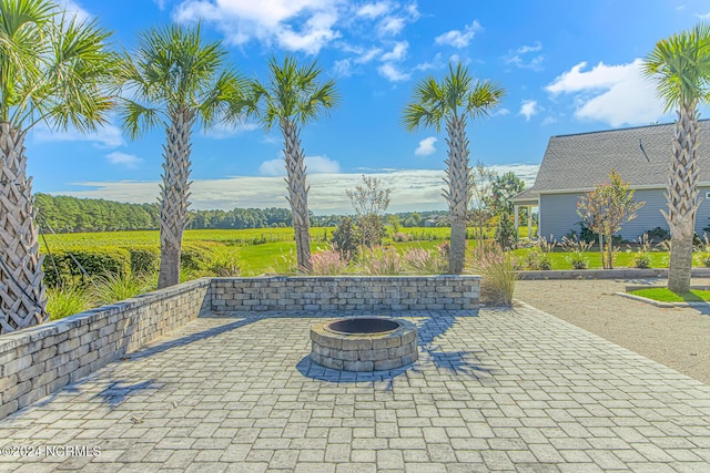 view of patio with an outdoor fire pit