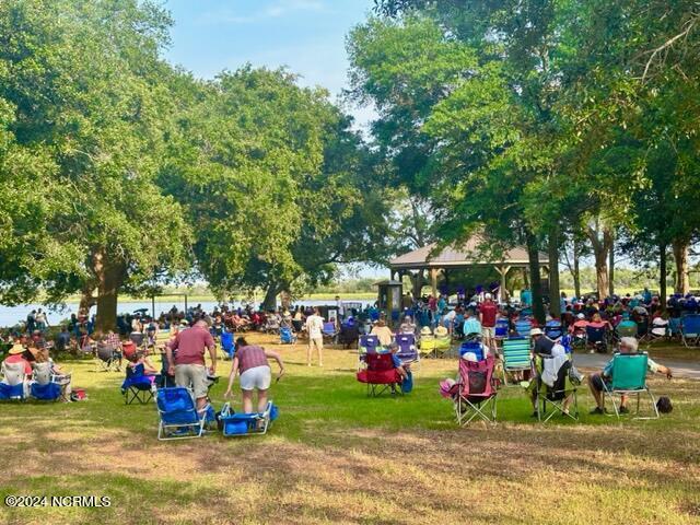 view of property's community featuring a lawn and a gazebo