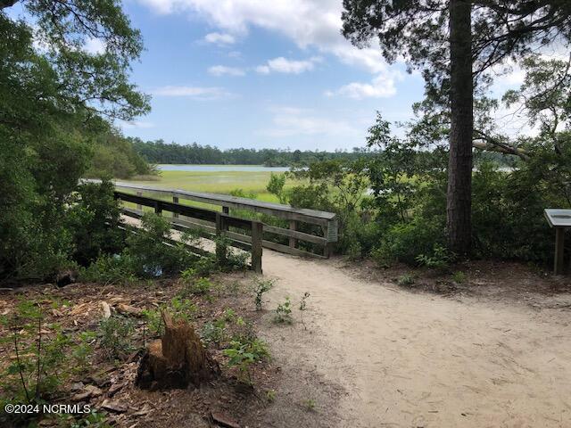 view of gate with a water view