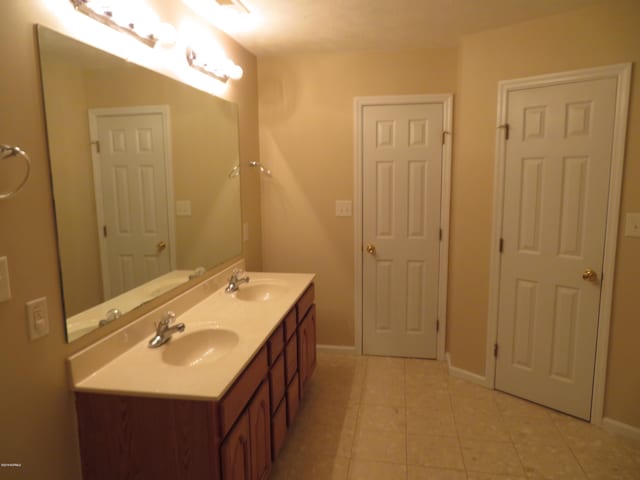 bathroom featuring vanity and tile patterned floors