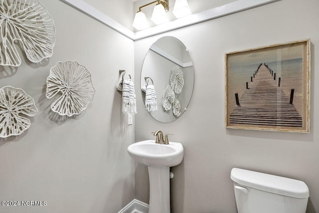 bathroom featuring toilet and sink