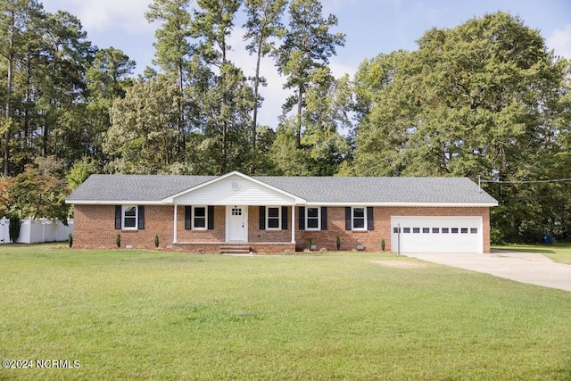 ranch-style home with a front yard and a garage