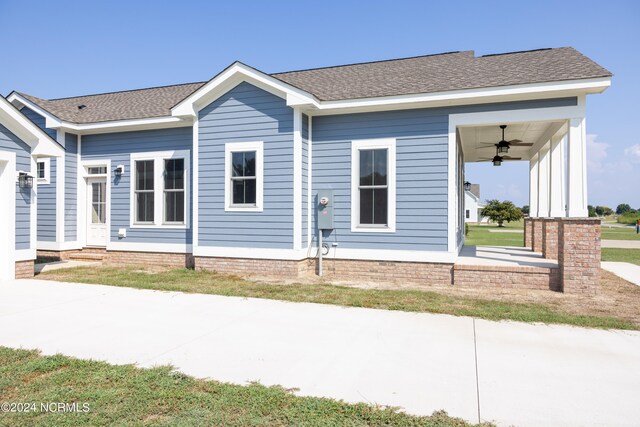 exterior space featuring ceiling fan