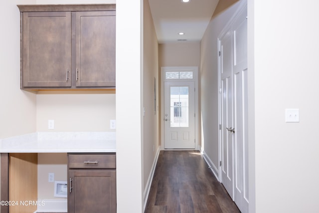 hallway with dark hardwood / wood-style floors