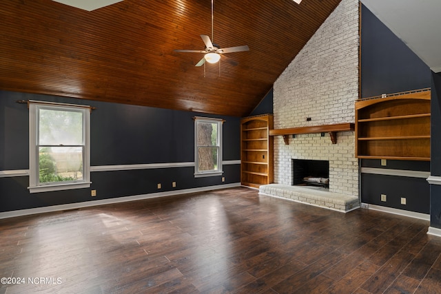 unfurnished living room featuring ceiling fan, a brick fireplace, dark hardwood / wood-style floors, and a wealth of natural light