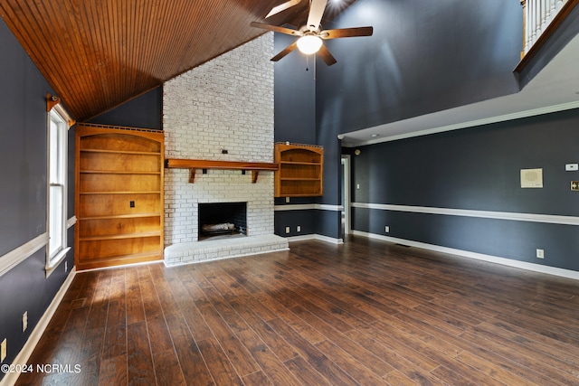 unfurnished living room with wood ceiling, a brick fireplace, ceiling fan, and dark wood-type flooring