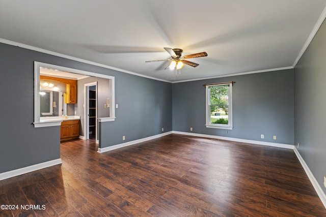 unfurnished room featuring ornamental molding, dark hardwood / wood-style flooring, and ceiling fan