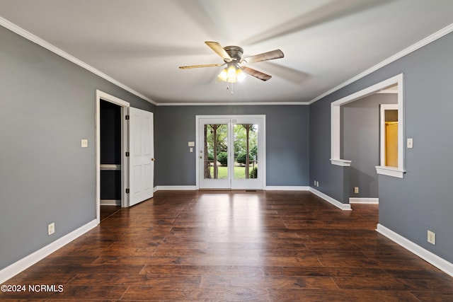 empty room featuring ceiling fan, dark hardwood / wood-style floors, and crown molding