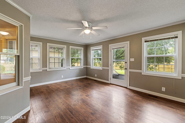 spare room featuring a textured ceiling, crown molding, dark hardwood / wood-style floors, and ceiling fan