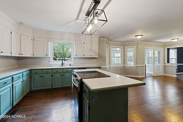 kitchen featuring a kitchen island, dark hardwood / wood-style flooring, stainless steel range with electric stovetop, and white cabinetry