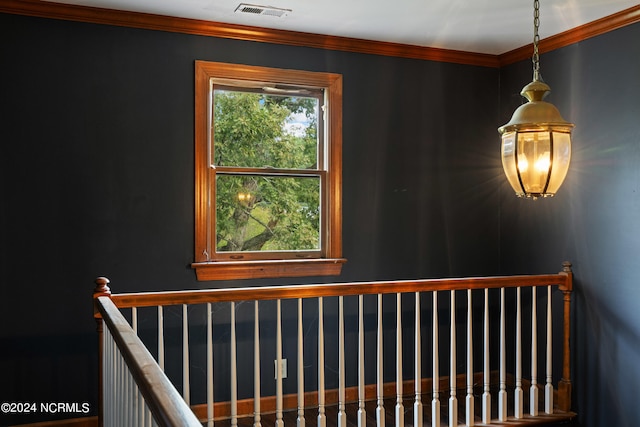 staircase featuring ornamental molding