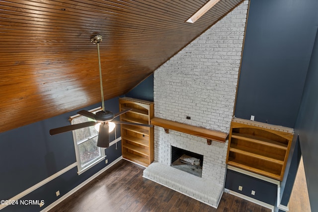 unfurnished living room with wood ceiling, lofted ceiling, ceiling fan, and a brick fireplace