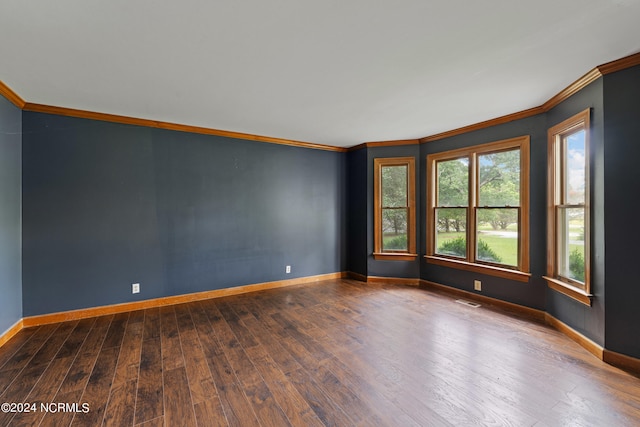 unfurnished room with crown molding and hardwood / wood-style flooring