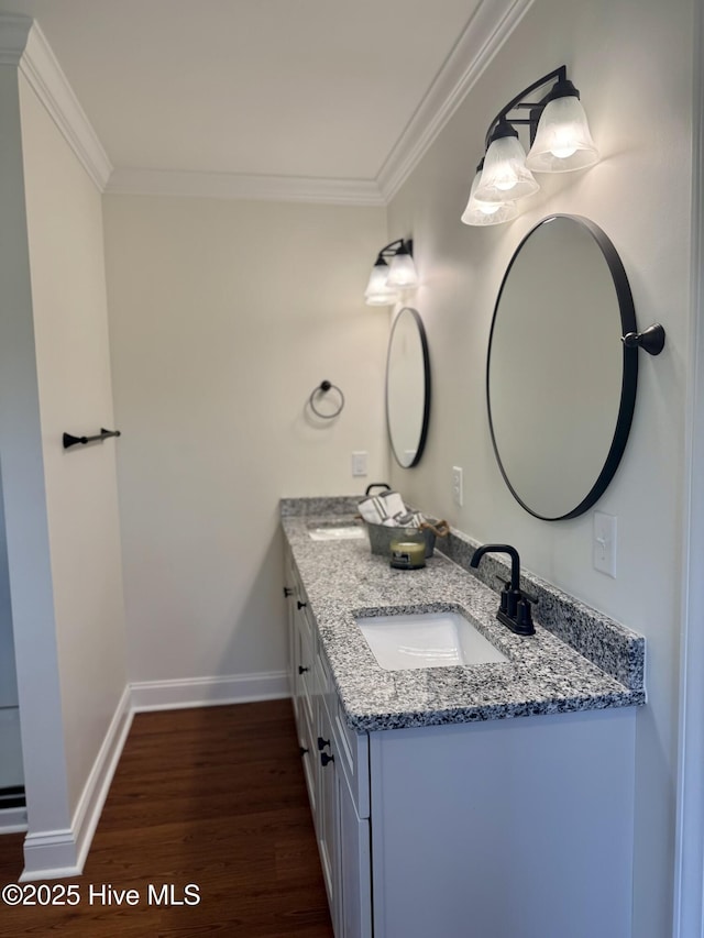 403 Main St, Bayboro, NC 28515 - bathroom with wood finished floors, crown molding, double vanity, and baseboards