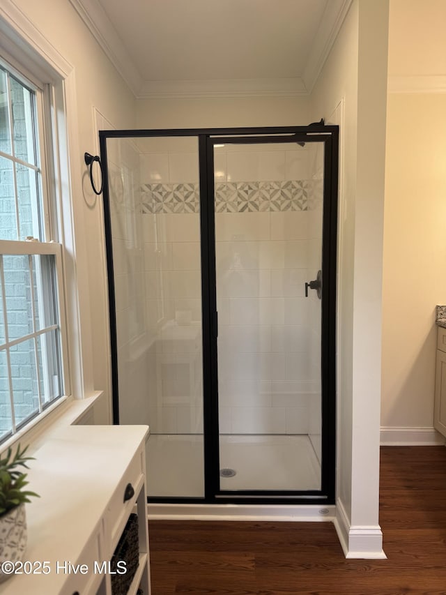 403 Main St, Bayboro, NC 28515 - bathroom featuring plenty of natural light, a shower stall, wood finished floors, and ornamental molding