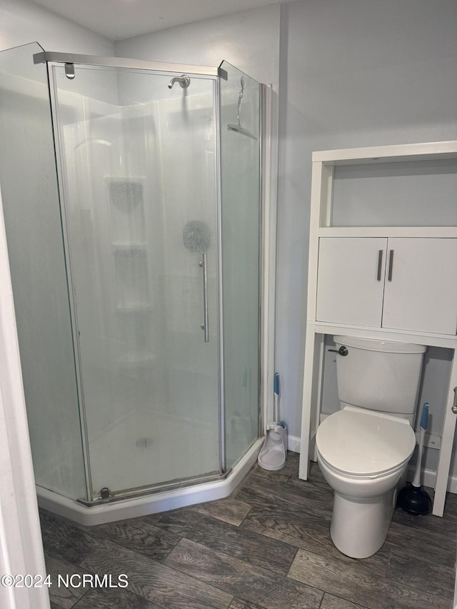 403 Main St, Bayboro, NC 28515 - full bath with a shower stall, wood finished floors, and toilet