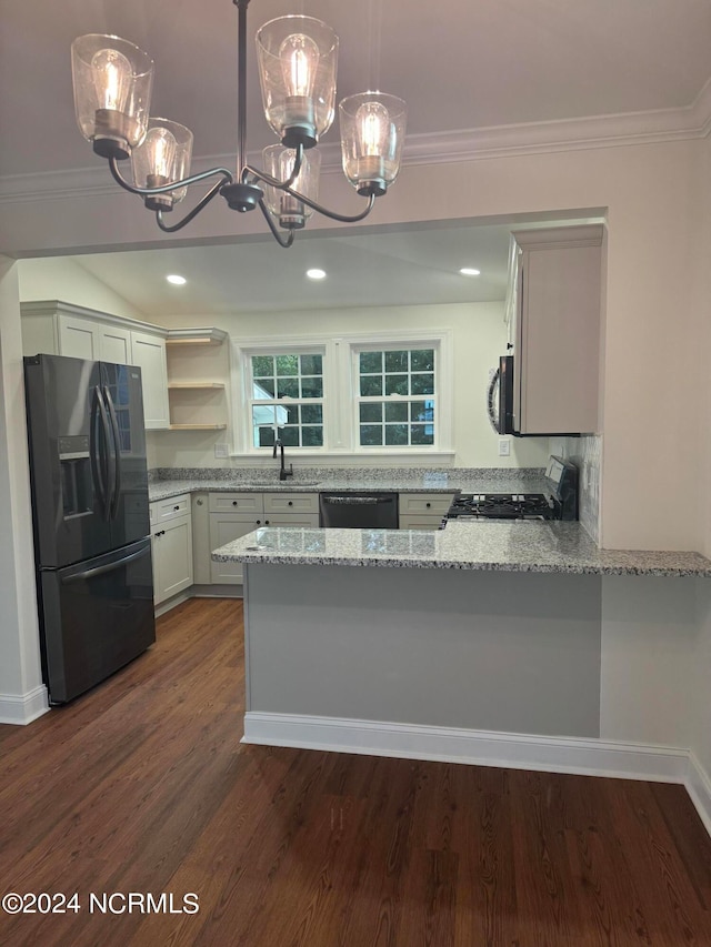 kitchen featuring kitchen peninsula, pendant lighting, dark wood-type flooring, black range with gas cooktop, and refrigerator with ice dispenser