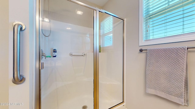 bathroom featuring an enclosed shower