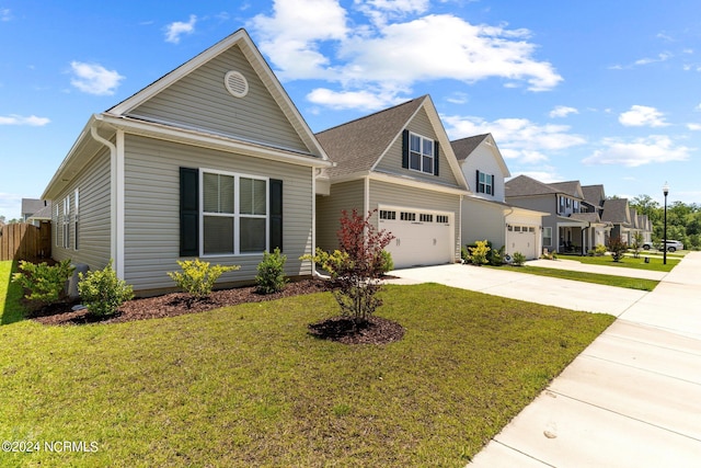 view of front of property with a garage and a front yard