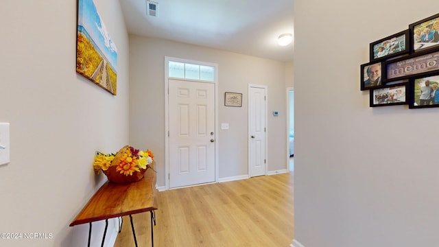 foyer with light wood-type flooring