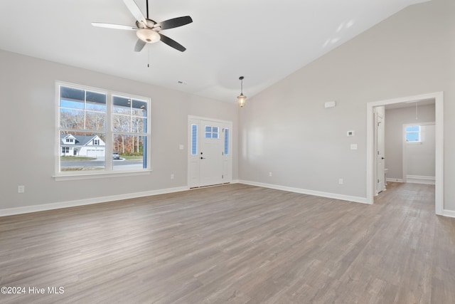 unfurnished living room featuring ceiling fan, high vaulted ceiling, and light hardwood / wood-style floors