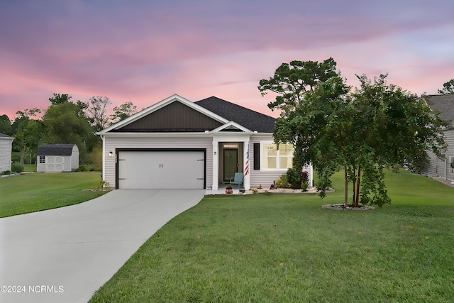 view of front of property with a garage, a storage shed, and a lawn