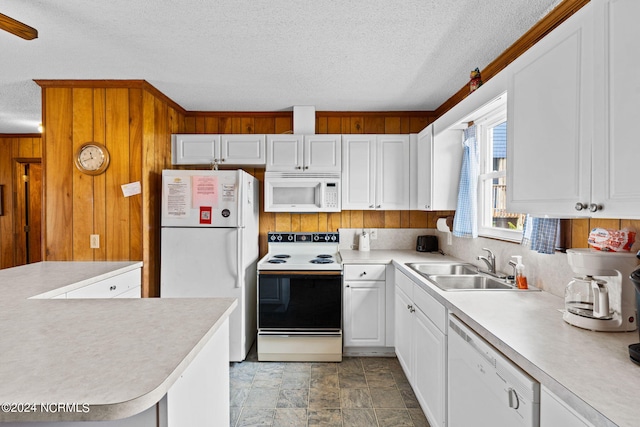 kitchen featuring white cabinets, a textured ceiling, sink, and white appliances