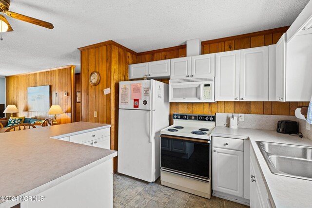 kitchen with a textured ceiling, white appliances, white cabinetry, and ceiling fan