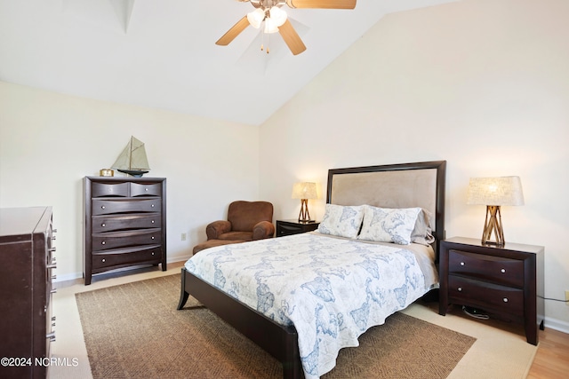 bedroom with lofted ceiling and ceiling fan