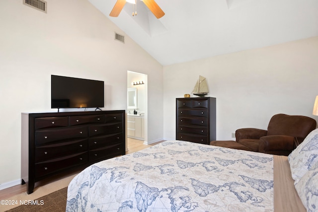 bedroom featuring connected bathroom, high vaulted ceiling, and ceiling fan