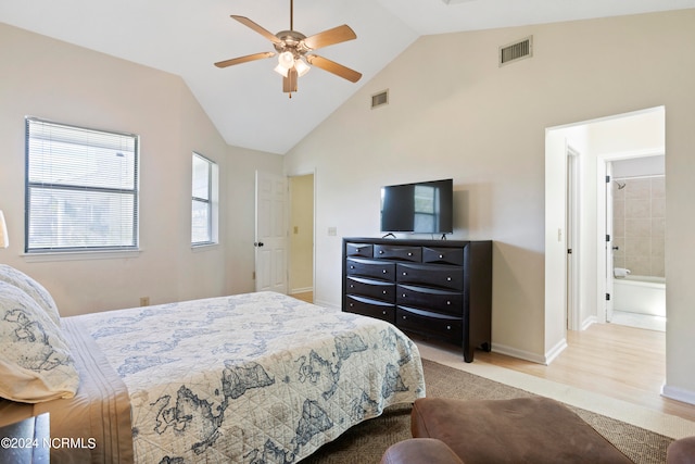 bedroom with lofted ceiling, ensuite bathroom, ceiling fan, and light hardwood / wood-style floors