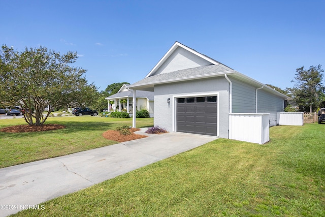 ranch-style home featuring a front lawn and a garage