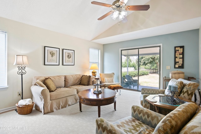 carpeted living room with lofted ceiling and ceiling fan