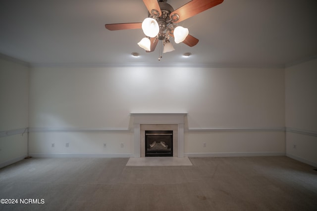 unfurnished living room with light carpet, baseboards, a fireplace with flush hearth, and crown molding