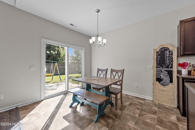 dining room with a notable chandelier