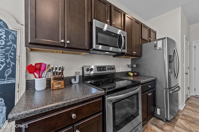 kitchen featuring stainless steel appliances and dark brown cabinetry