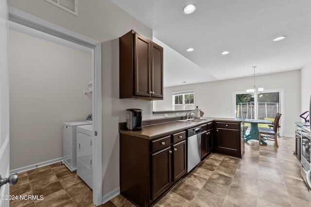 kitchen with sink, an inviting chandelier, dishwasher, pendant lighting, and washer and clothes dryer