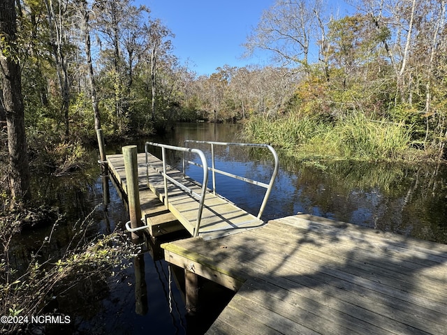 view of dock with a water view