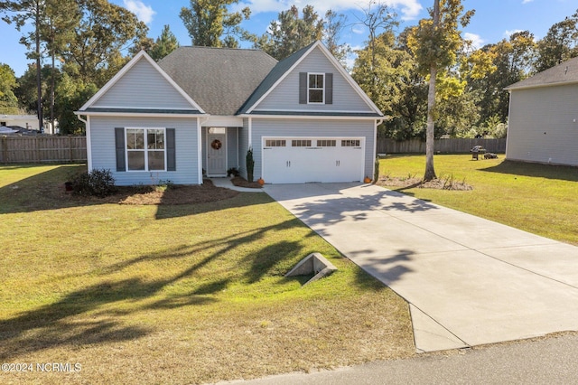 view of front of home featuring a garage and a front yard