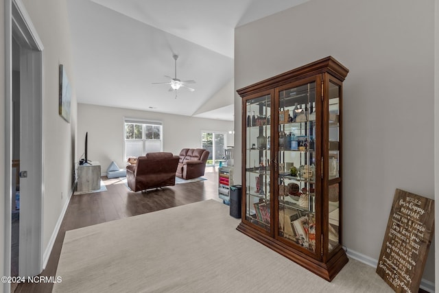 interior space featuring hardwood / wood-style flooring, vaulted ceiling, and ceiling fan