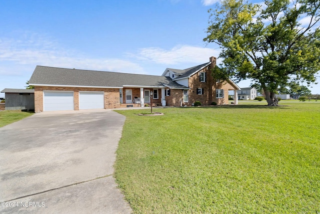 view of front of house with a garage and a front lawn