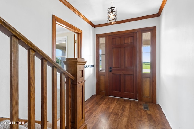 foyer featuring dark hardwood / wood-style flooring and ornamental molding