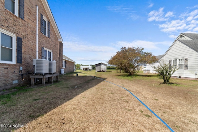 view of yard with central AC