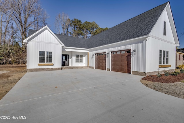 modern inspired farmhouse featuring a garage