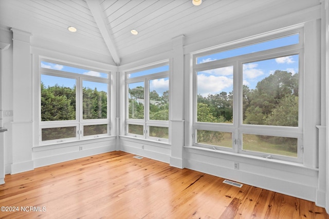 unfurnished sunroom with wooden ceiling and lofted ceiling with beams